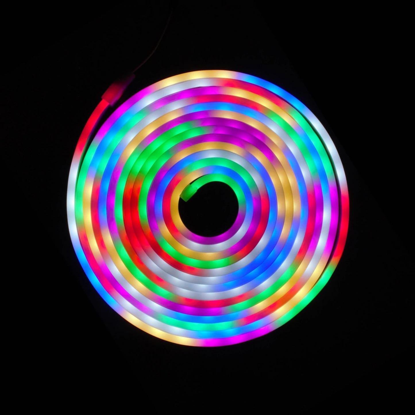 Tira LED flexible multicolor RGB con efecto neón, enrollada en espiral, para iluminación decorativa.