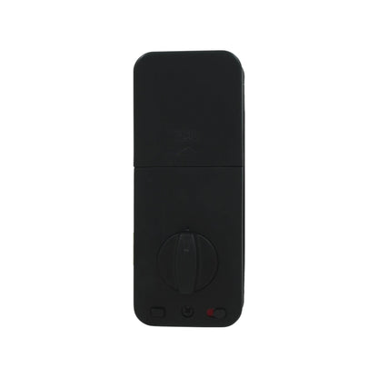 Vista interior de cerradura inteligente negra con perilla de seguridad, cubierta de batería y luz LED.