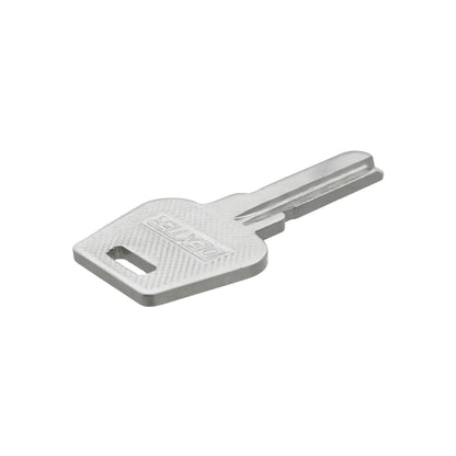 Llave virgen Dexter de metal plateado para duplicados y servicios de cerrajería profesional.