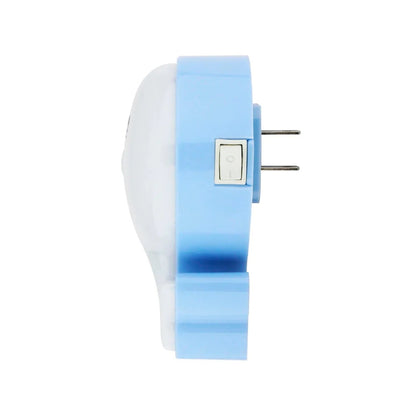 Lámpara de noche LED azul y blanca con forma de ballena, interruptor y enchufe de pared.